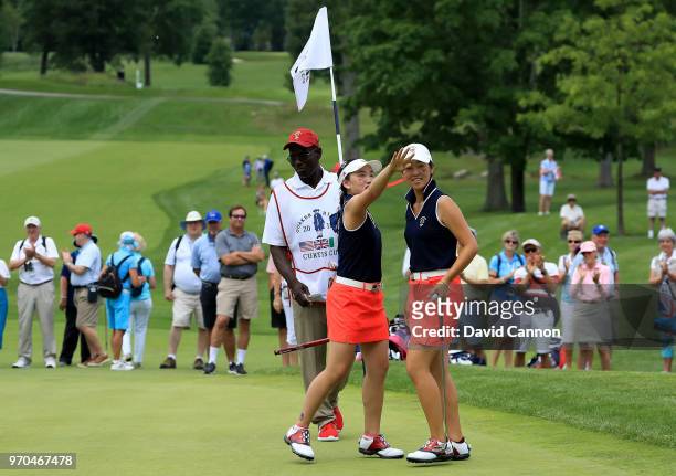 Lucy Li celebrates with Andrea Lee of the United States after they had won their match by 3&2 against Lily May Humphreys and Shannon McWilliam of the...