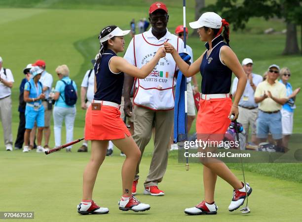 Lucy Li celebrates with Andrea Lee of the United States after they had won their match by 3&2 against Lily May Humphreys and Shannon McWilliam of the...