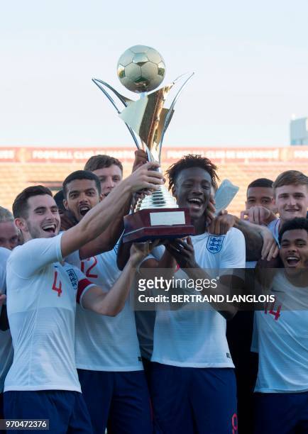 England's captain Lewis Cook and teammates hold the trophy after winning the Maurice Revello International tournament Under 20 football football...