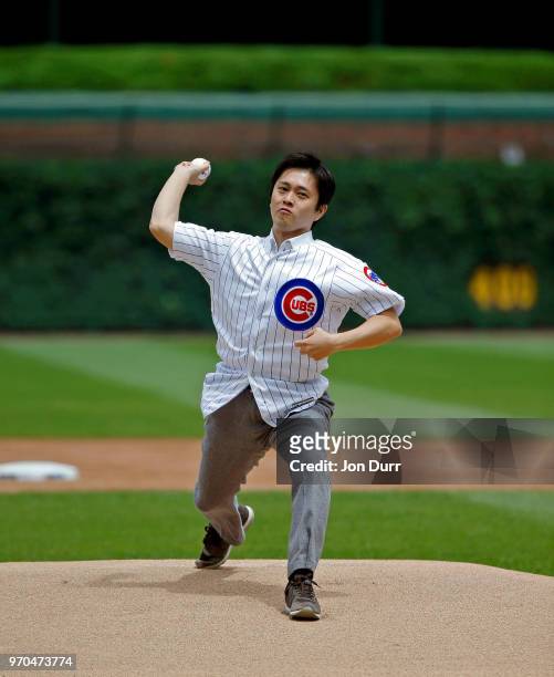 Hirofumi Yoshimura, mayor of Osaka, Japan, throws out a ceremonial first pitch before the game between the Chicago Cubs and the Pittsburgh Pirates at...