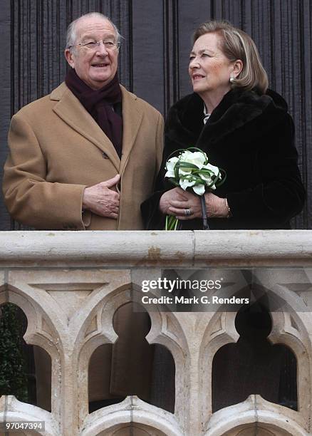 King Albert of Belgium and Queen Paola of Belgium salute the crowd at the Townhall during their visit on February 25, 2010 in Dendermonde, Belgium.