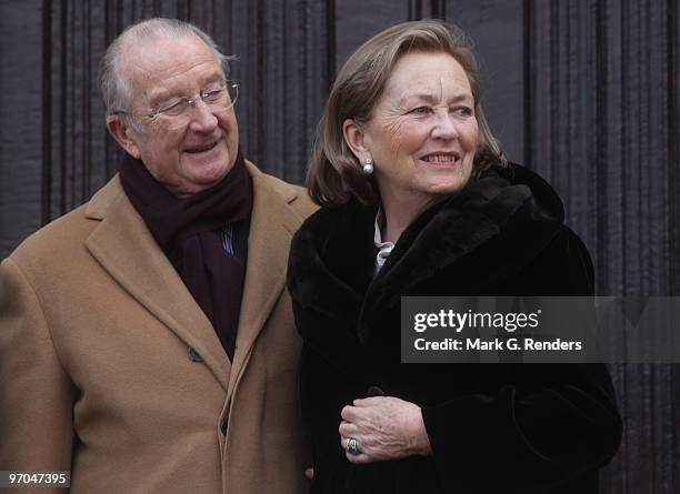 King Albert of Belgium and Queen Paola of Belgium salute the crowd at the Townhall during their visit on February 25, 2010 in Dendermonde, Belgium.
