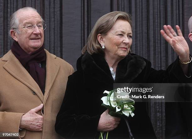 King Albert of Belgium and Queen Paola of Belgium salute the crowd at the Townhall during their visit on February 25, 2010 in Dendermonde, Belgium.