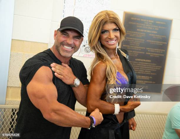 Joe Gorga and Teresa Giudice pose at the NPC South Jersey Bodybuilding Championships on June 9, 2018 in Medford, New Jersey.