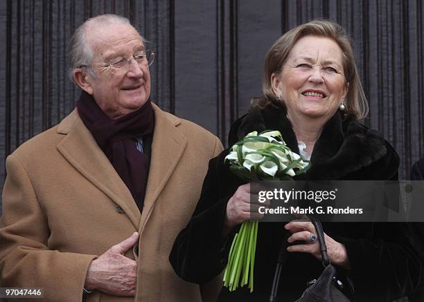 King Albert of Belgium and Queen Paola of Belgium salute the crowd at the Townhall during their visit on February 25, 2010 in Dendermonde, Belgium.