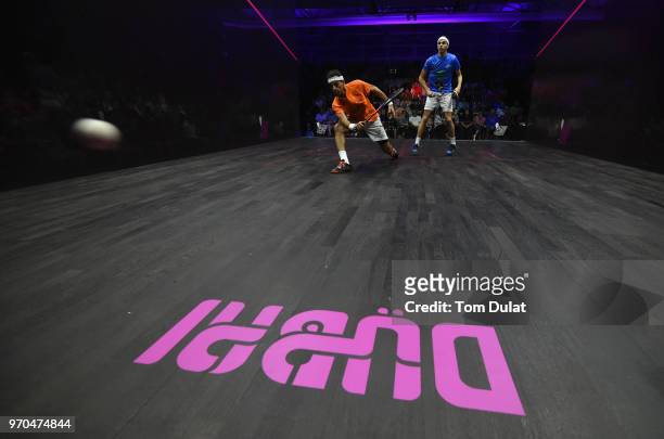 Mohamed Elshorbagy of Egypt and Ali Farag of Egypt compete during the men's final match of the PSA Dubai World Series Finals 2018 at Emirates Golf...