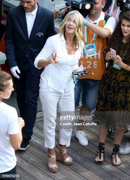 Nadia Comaneci is all smiles following the victory of countrywoman Simona Halep of Romania following the final on Day 14 of the 2018 French Open at...