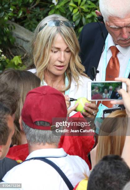 Nadia Comaneci is all smiles following the victory of countrywoman Simona Halep of Romania following the final on Day 14 of the 2018 French Open at...