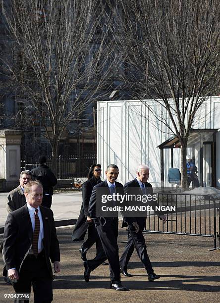 President Barack Obama and Vice President Joe Biden walk across Pennsylvania Avenue from the White House to Blair House for a bipartisan meeting to...