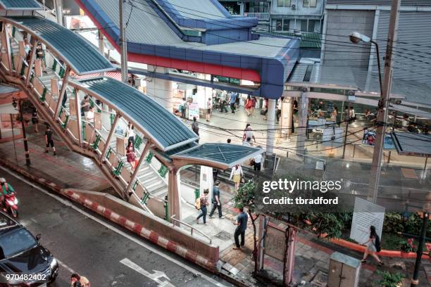 entrance to the bts and mrt railways at asok in bangkok, thailand - asok station stock pictures, royalty-free photos & images