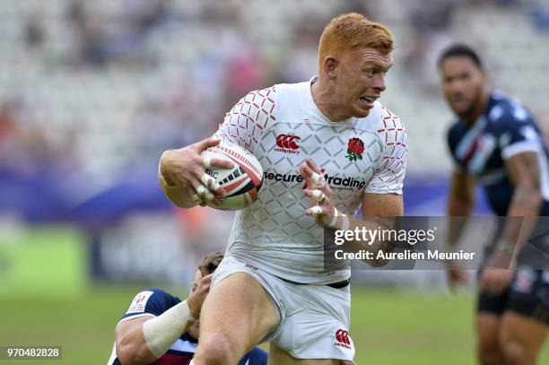 James Rodwell of England is tackled during the match between England and the United States Of America at the HSBC Paris Sevens, stage of the Rugby...