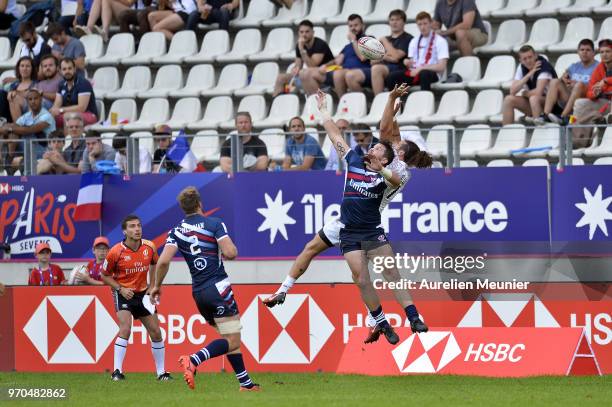 Mike Ellery of England and Danny Barrett of The United States Of America jump for the ball during the match between England and the United States Of...