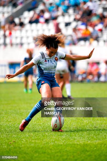 France's Caroline Drouin kicks the ball during the quarter-final of the Women's tournament of 2018 Rugby World Cup Sevens game between France and...