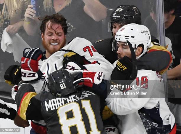 John Carlson and Chandler Stephenson of the Washington Capitals fight Jonathan Marchessault and Shea Theodore of the Vegas Golden Knights after a...