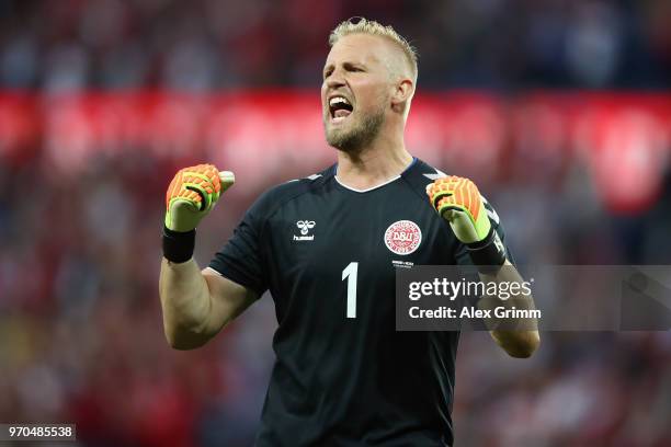 Goalkeeper Kasper Schmeichel of Denmark celebrates after teammate Yussuf Poulsen scores his team's first goal during the international friendly match...