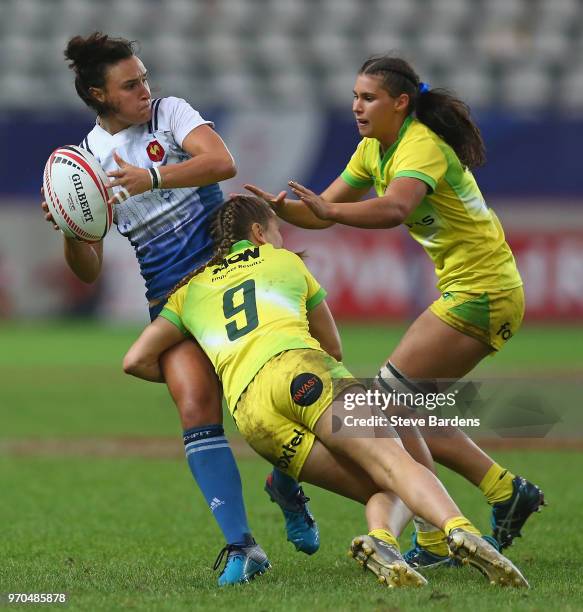 Shannon Izar of France is tackled by Emma Sykes of Australia during the Women's Cup semi final between Australia and France during the HSBC Paris...