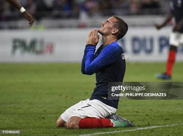 France's forward Antoine Griezmann reacts after missing a goal opportunity during the friendly football match between France and USA on June 9 at the...