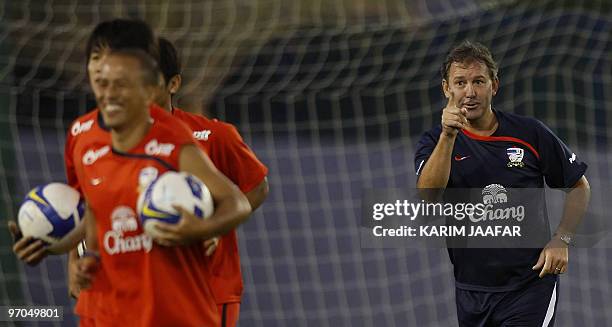 Thailand's coach and former England captain Bryan Robson gestures at his team during a training session in Doha on February 25, 2010. Thailand will...