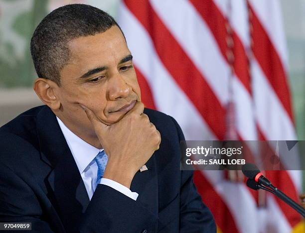 President Barack Obama listens as Republican Congressional leadership speaks while hosting a bipartisan meeting with members of Congress to discuss...