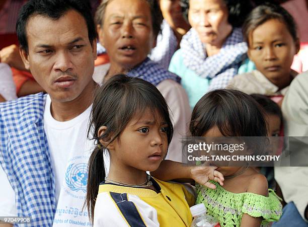 People listen to speeches during the 58th Anniversary of International Human Rights in Phnom Penh, 10 December 2006. The US ambassador to Cambodia...