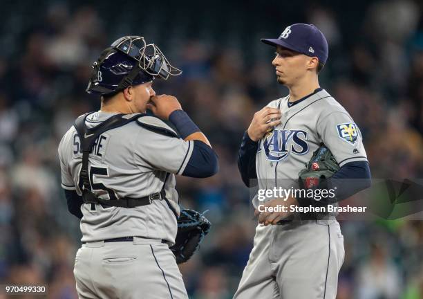 Catcher Jesus Sucre of the Tampa Bay Rays and starting pitcher Blake Snell of the Tampa Bay Rays met at the pitcher's mound during a game against the...