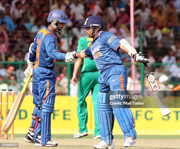 Sachin Tendulkar and Dinesh Karthik at the Gwalior ODI against South Africa in Gwalior on Wednesday, February 24, 2010.