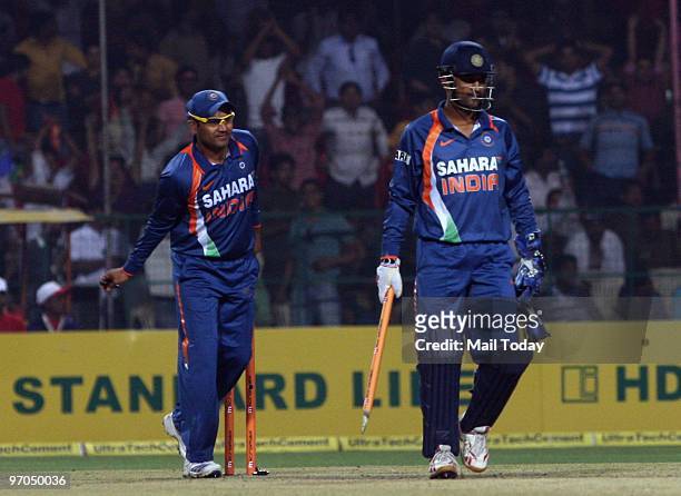 Virender Sehwag and Mahendra Singh Dhoni celebrate after winning the ODI against South Africa in Gwalior on Wednesday, February 24, 2010.