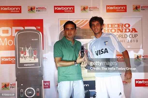 Argentine hockey players Lucas Rey and India's Deepak Thakur at a press conference in Delhi to accounce Indian Cellular Phone manufacturer Karbonn's...
