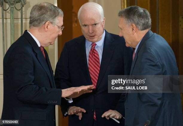 Senate Minority Leader Mitch McConnell talks with Arizona Senator John McCain and Senate Minority Whip Jon Kyl prior to the start of a bipartisan...