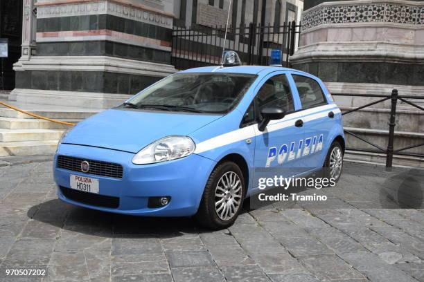 fiat grande punto police car on the street - fiat punto stock pictures, royalty-free photos & images