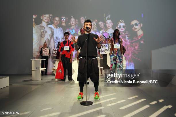 Omi of VIN + OMI speaks at the VIN + OMI press launch during London Fashion Week Men's June 2018 at 180 The Strand on June 9, 2018 in London, England.