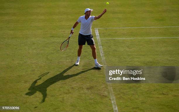 Brydan Klein of Great Britain serves during his qualifying match against Marcus WIllis of Great Britain Day One of the Nature Valley Open at...