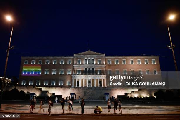 Rainbow flag is projected on the facade of the Greek parliament building in Athens during the annual Gay Pride Parade on June 9, 2018 in Athens. -...