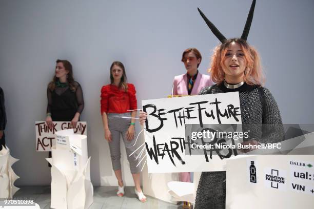 Models pose during the VIN + OMI press launch at London Fashion Week Men's June 2018 at 180 The Strand on June 9, 2018 in London, England.