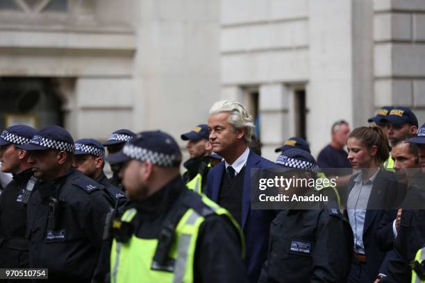 Dutch right-wing 'Partij voor de Vrijheid' leader Geert Wilders is escorted by police after delivering a speech at a rally in support of British...
