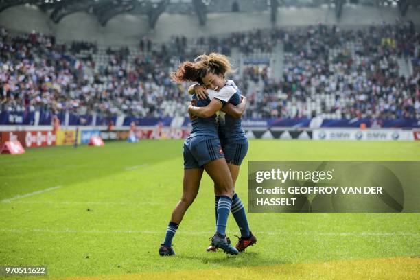 France's Anne-Cecile Ciofani and France's Caroline Drouin celebrate during the quarter-final of the Women's tournament of 2018 Rugby World Cup Sevens...