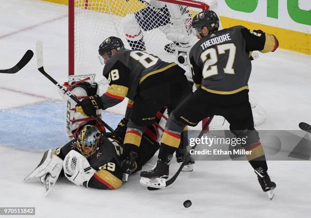 Marc-Andre Fleury of the Vegas Golden Knights makes a diving save on a shot by Jakub Vrana of the Washington Capitals as Nate Schmidt and Shea...