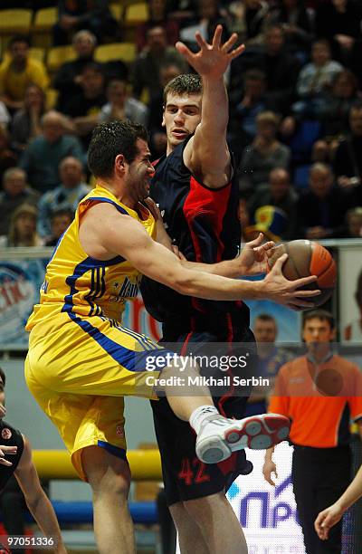 Carlos Cabezas, #10 of BC Khimki competes with Stanko Barac, #42 of Caja Laboral in action during the Euroleague Basketball 2009-2010 Last 16 Game 4...