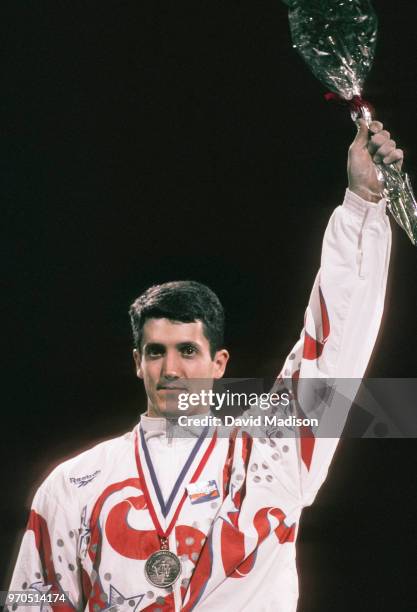 John Roethlisberger of the United States waves to the crowd during an award ceremony at the Budget Rent A Car Invitational Gymnastics Meet held on...