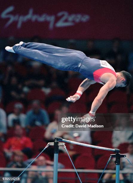 John Roethlisger of the United States competes on the high bar during the Men's Gymnastics events of the Olympic Games on September 1 2000 in Sydney,...