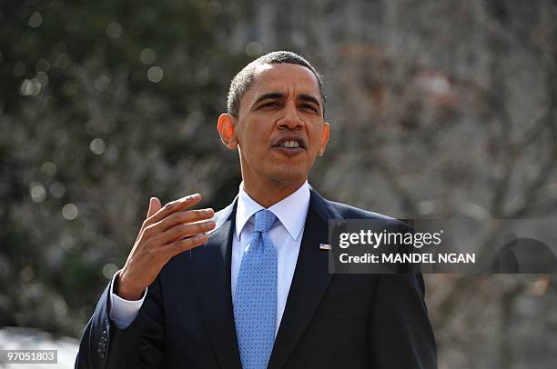 President Barack Obama speaks to reporters as he walks back to the White House from Blair House during a bipartisan meeting to discuss health reform...