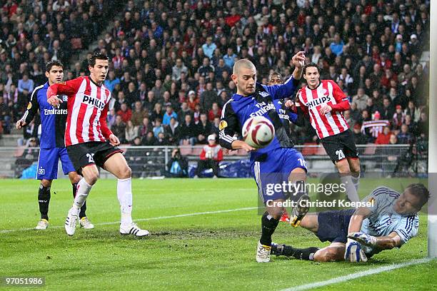 Mladen Petric of Hamburg and Frank Rost save a ball during the UEFA Europa League knock-out round, first leg match between PSV Eindhoven and...