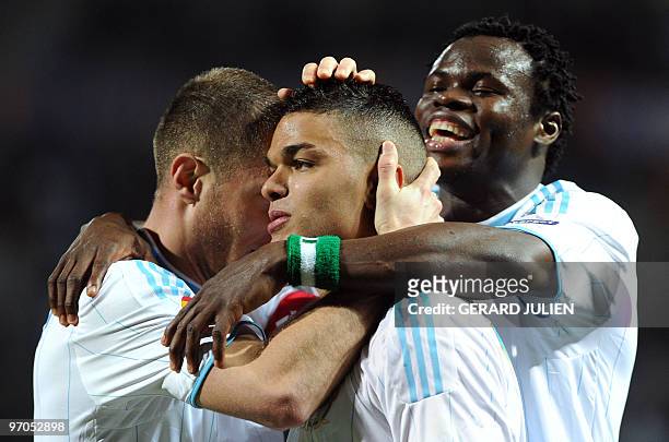 Olympique Marseille's midfielder Hatem Ben Arfa is congratulated by his teammates after scoring a goal during the Europa league football match...