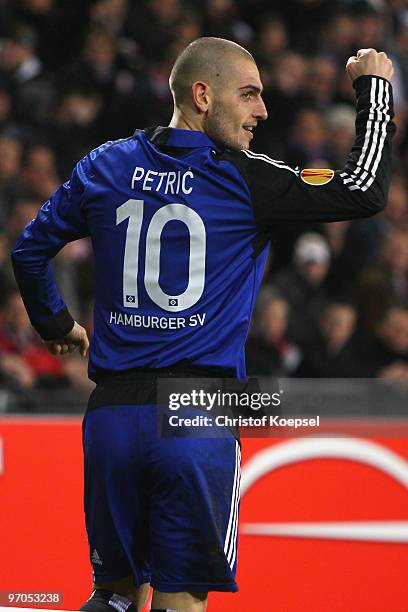 Mladen Petric of Hamburg celebrates his team's first goal during the UEFA Europa League knock-out round, first leg match between PSV Eindhoven and...