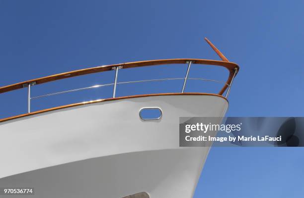 bow of a large luxury yacht - proas fotografías e imágenes de stock