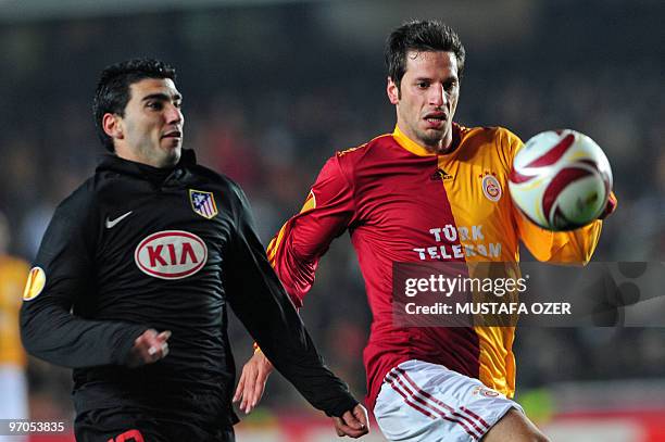 Jose Antonio Reyes of Atletico Madrid vies with Galatasaray's Hakan Balta during their UEFA Europa League football match at Ali Sami Yen Stadium...