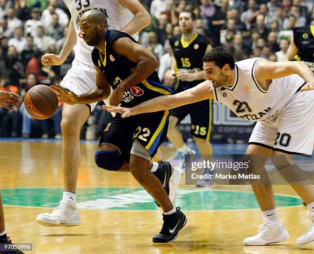 Jamon Lucas, #22 of Maroussi BC competes with Petar Bozic, #20 of Partizan Belgrade in action during the Euroleague Basketball 2009-2010 Last 16 Game...