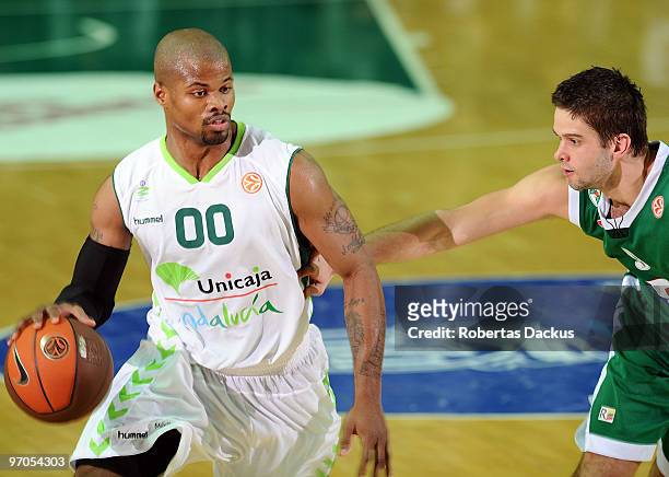 Omar Cook, #00 of Unicaja competes with Mantas Kalnietis, #9 of Zalgiris Kaunas in action during the Euroleague Basketball 2009-2010 Last 16 Game 4...