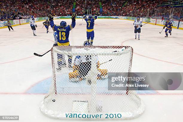 Johansson Uden of Sweden celebrates after teammate Maria Rooth scores a goal during the ice hockey women's bronze medal game between Finland and...