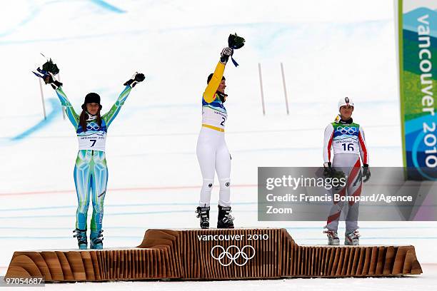 Viktoria Rebensburg of Germany takes the Gold Medal, Tina Maze of Slovenia takes the Silver Medal, Elisabeth Goergl of Austria takes the Bronze Medal...